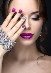 Canvas Print - girl with a bright make-up and manicure with rhinestones. 