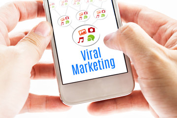 Wall Mural - close up two hand holding smart phone with viral marketing word