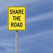 A Road Sign Indicating Share The Road
