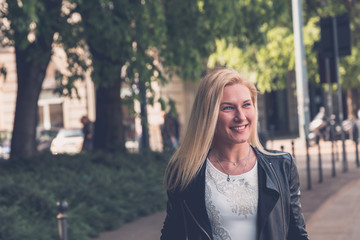 Beautiful girl posing in the city streets