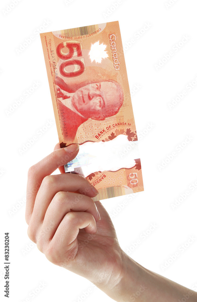 Female hand with Canadian 50 Dollar, isolated on white