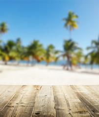 Empty wooden pier with view on sandy beach