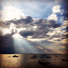 Dramatic Seascape At Sunrise, Sunrays Shining Through Clouds