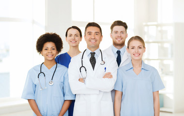 Poster - group of happy doctors at hospital