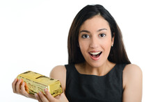 Cheerful Young Woman Holding Gold Bar Ingot Piggy Bank