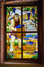 Stained Glass Old Window With The Image Of A Winemaker With A