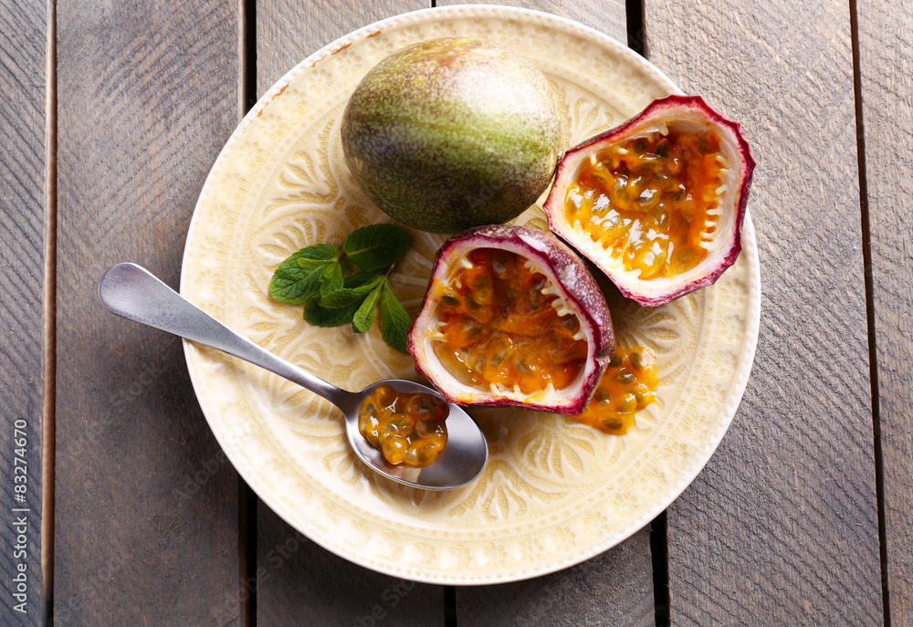 Passion fruits on wooden background