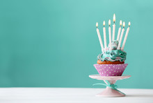 Delicious Birthday Cupcake On Blue Background