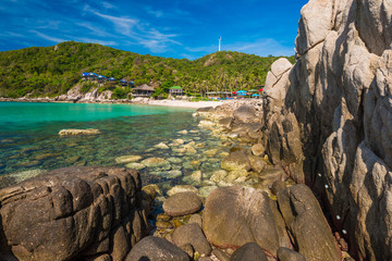 Rock beach and blue sky with beautiful clouds tropical sea