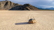 Moving stones in desert in the Racetrack playa, Death Valley National Park, California