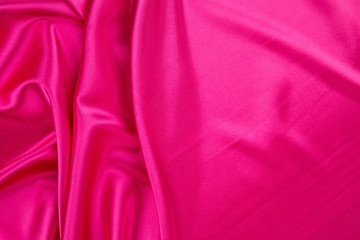 Wall Mural - Soft folds of pink silk cloth texture.