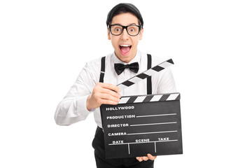 Canvas Print - Excited movie director holding a clapperboard