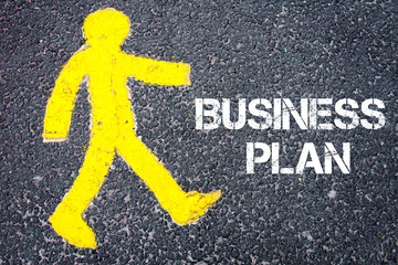 Yellow pedestrian figure walking towards BUSINESS PLAN