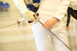 fencer with fencing mask and rapier
