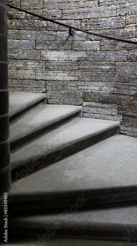 Naklejka na drzwi stone steps of the spiral staircase to the top