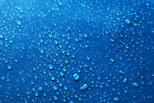 Water Drops On Blue Background