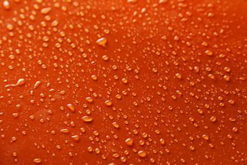 Water drops on orange background