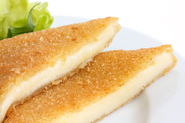 Square fried cheese, cut, melting with salad.