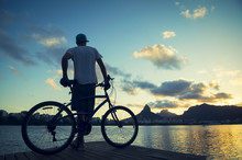 Sunset Silhouette Man With Bicycle Lagoa Rio De Janeiro Brazil