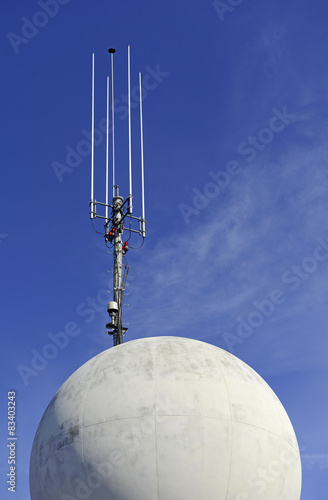 Fotografie, Tablou Antenna on skyscraper with blue sky