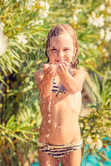 Happy child taking shower