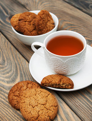 Canvas Print - Cup of tea with oatmeal cookies