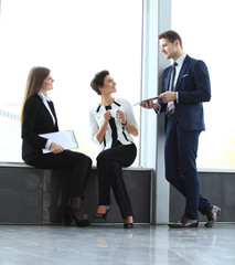 Canvas Print - Image of business partners discussing documents and ideas 