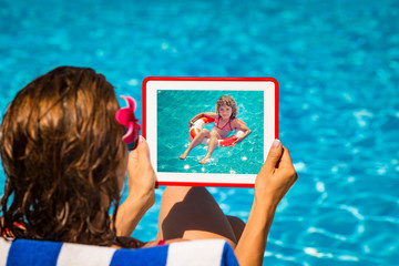 Wall Mural - Woman holding tablet PC