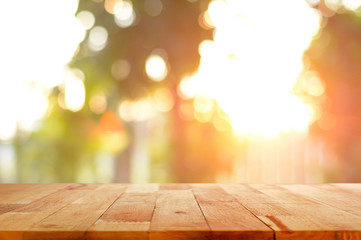 Wall Mural - Wood table top on shiny sunlight bokeh background