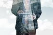 © WavebreakMediaMicro - Composite image of businessman scrolling on his digital tablet
