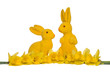 Yellow easter bunnies with yellow daffodils isolated at a white background