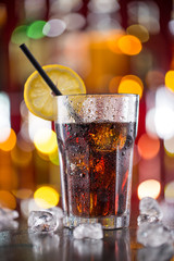 Glass of cola on bar desk