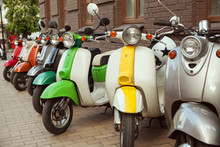 Row Of Mopeds On A Street 