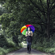 © RooM The Agency - Woman with multicolored umbrella