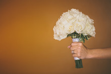 USA, Florida, Okaloosa County, Fort Walton Beach, Bride Holding Bouquet Of Roses 