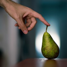 Spain, Man Touching Pear