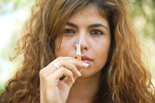 Portrait Of Long Haired Woman With Cigarette