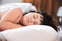 Girl Sleeping On Big Pillow