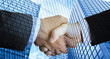 © Sondem - Business People Shaking Hands