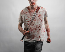 Guy In A Bloody Shirt Holding A Bloody Bat On A White Background