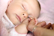 © Christin Lola - Sleeping Baby Girl Holding Mother's Hand