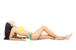  young woman posing in bikini lying on white floor