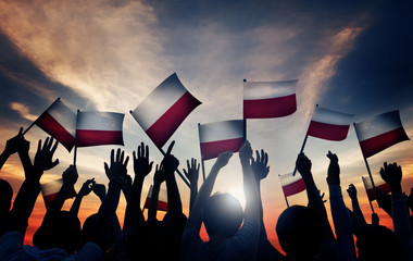 Sticker - Group of People Waving Polish Flags in Back Lit