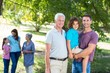 © WavebreakMediaMicro - Extended family smiling in the park