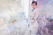 © WavebreakmediaMicro - Composite image of confident businesswoman holding laptop