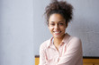 Happy mixed race woman smiling indoors