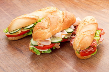 Wall Mural - sandwiches on wooden table