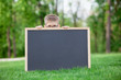 © Masson - young boy with a blackboard