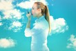 © WavebreakMediaMicro - Composite image of beautiful blonde using an asthma inhaler