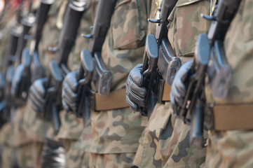 Army parade - armed soldiers in camouflage military uniform